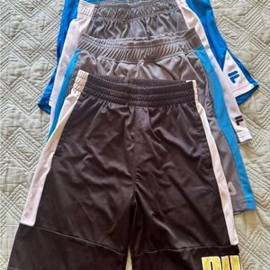 4 pairs boys shorts, size 10-12. Braids Fila and Puma.  Elastic Waisband